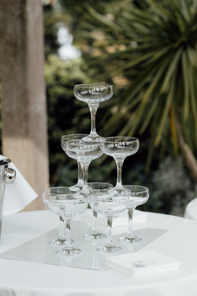 A stack of coupe champagne glasses.