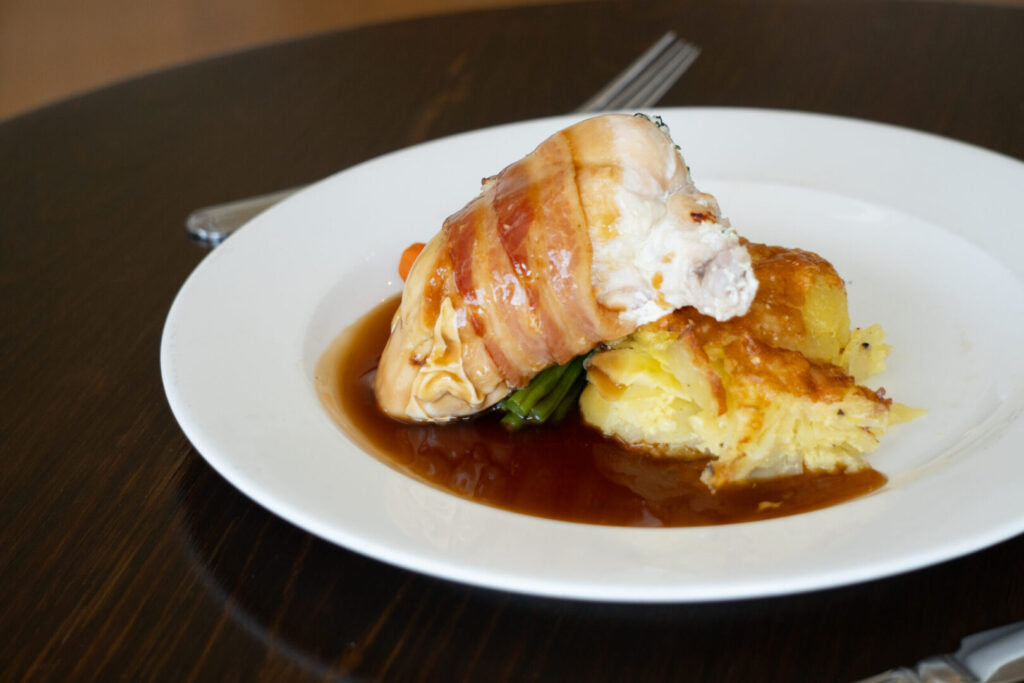 A chicken meal on a white plate.