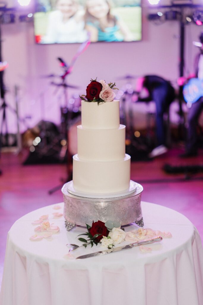 A large white tiered wedding cake.