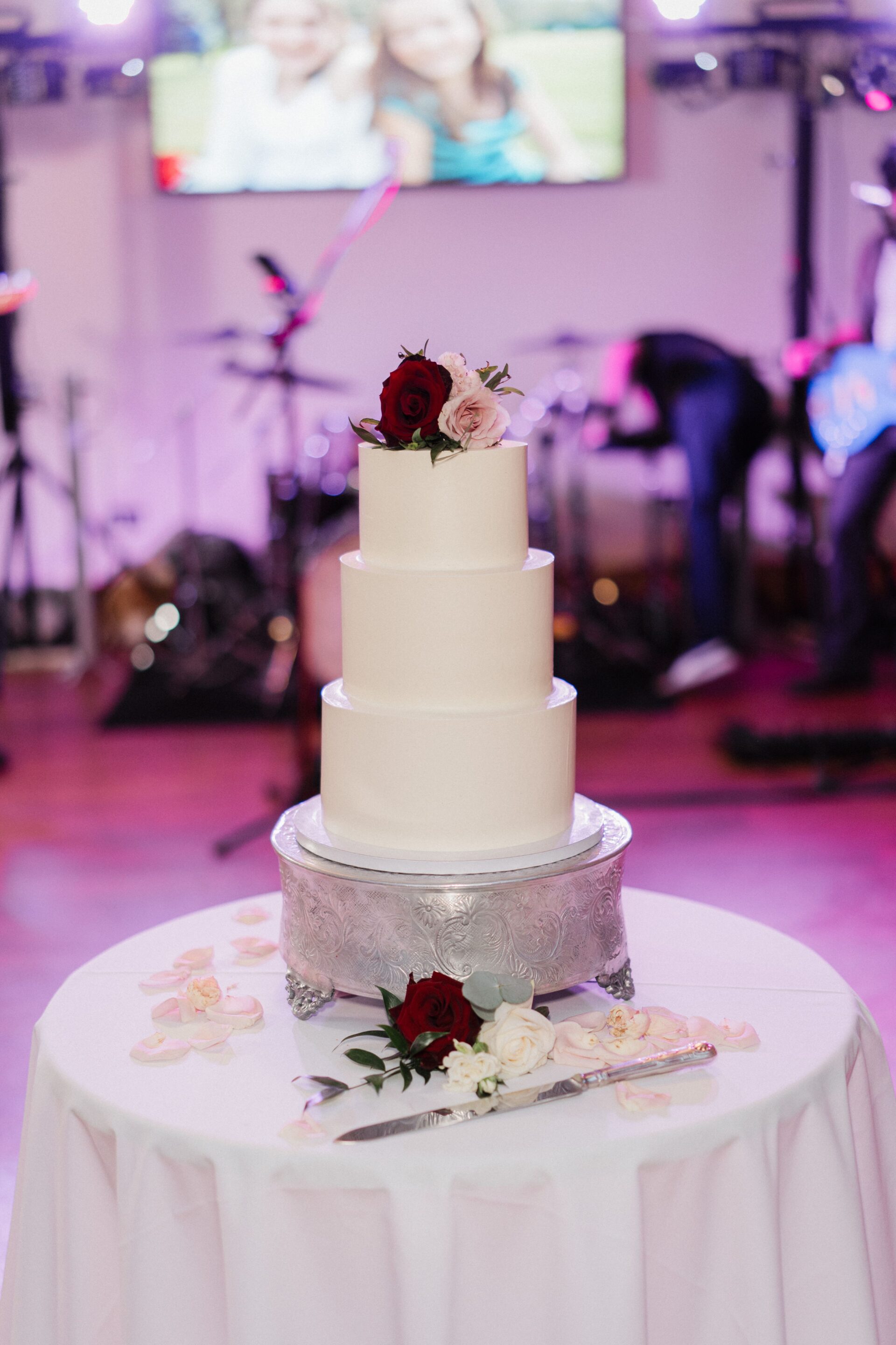 A large white tiered wedding cake.
