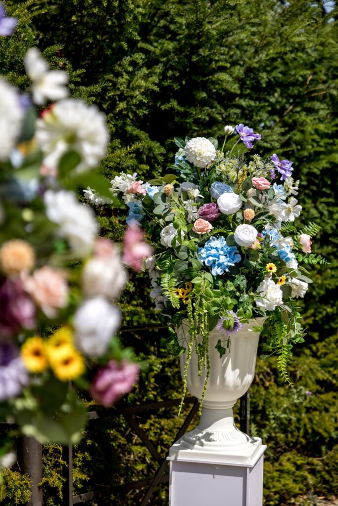 A close up of colourful floral arrangements in a garden.