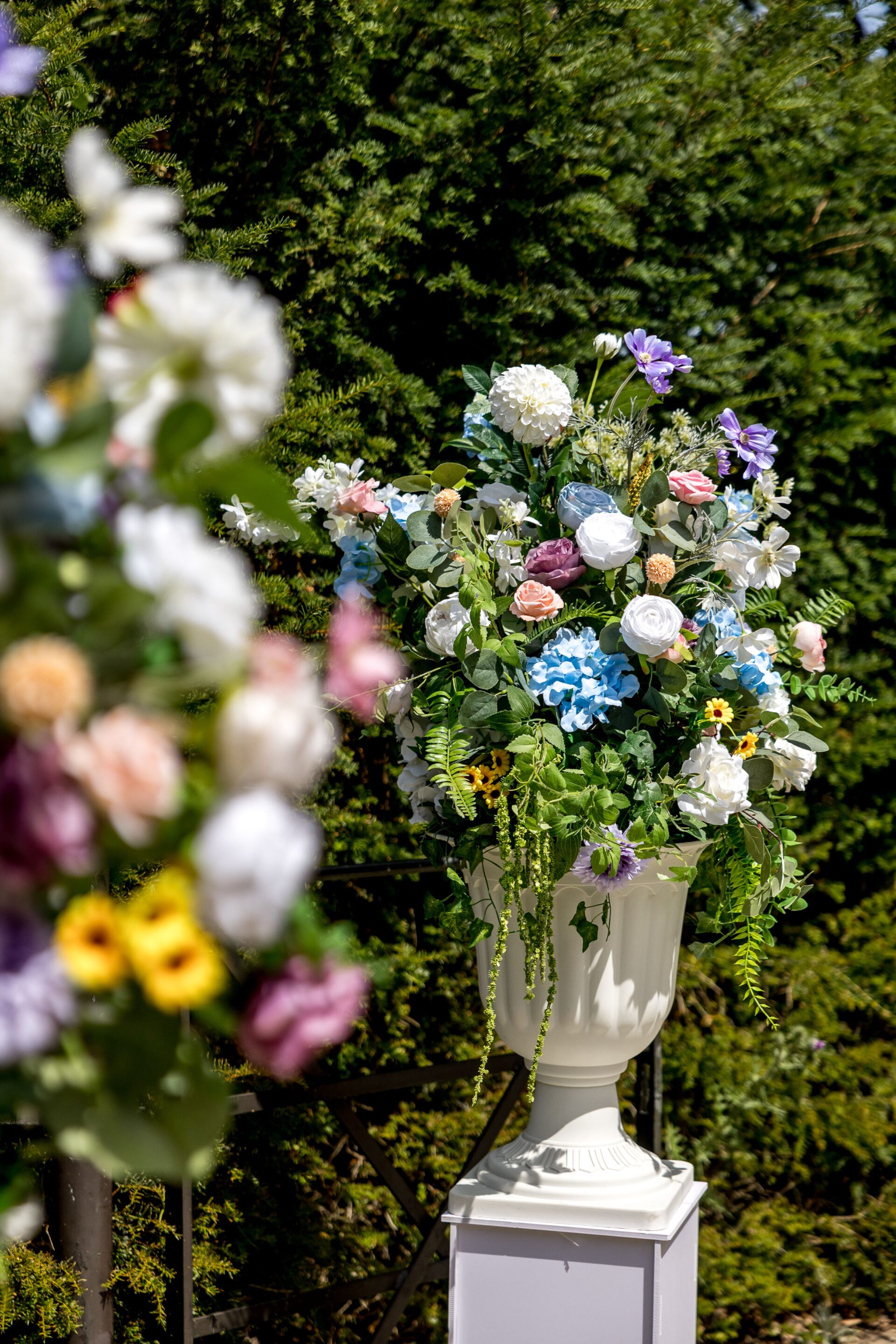 A close up of colourful floral arrangements in a garden.