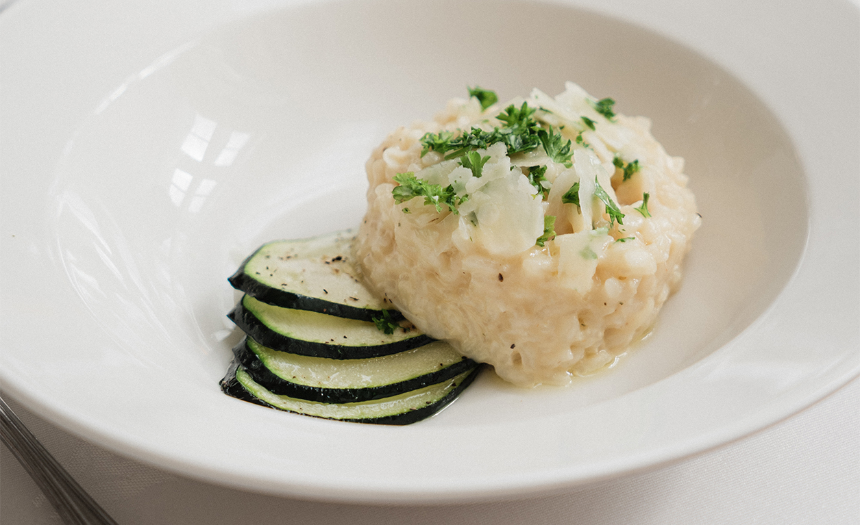 A white plate featuring a colourful vegetable dish